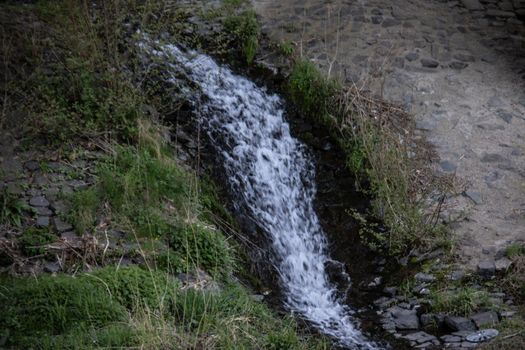 wild river in winter with spray