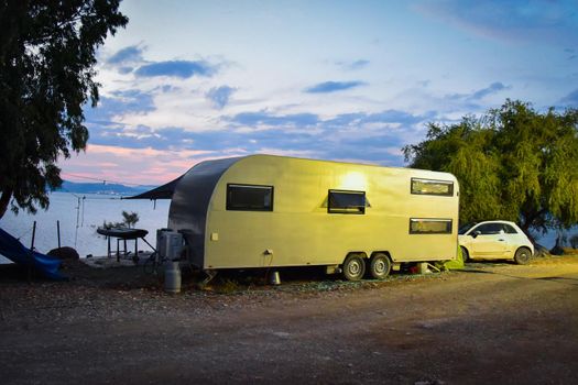 Sunset over the Sea of Galilee and Golan Heights. Caravan campaign by the sea. High quality photo