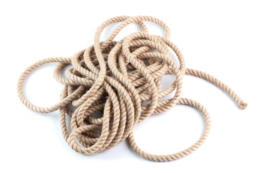coil of natural 10 mm Jute Hessian Rope Cord Braided Twisted isolated on white background.