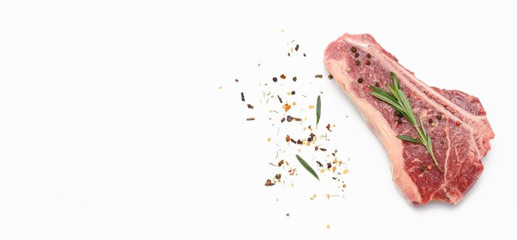 fresh raw piece of beef meat, striploin steak on white background, top view, copy space