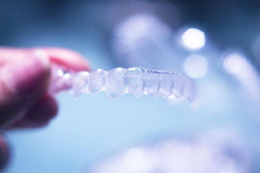 Clear denture to align teeth. No people