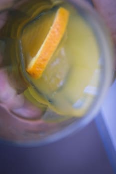 Orange soda in a crystal glass with a piece of natural orange. No people