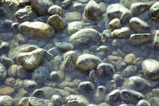 Set of natural stones on the bank of a river. No people