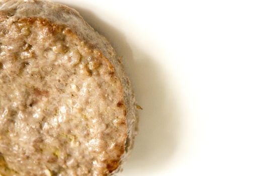 Organic beef burger on white plate. No people