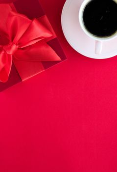 Romantic celebration, lifestyle and birthday present concept - Luxury beauty gift box and coffee on red, flatlay