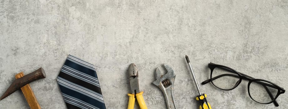 Top view design concept of Father's day and labor day with working tools on blue background.