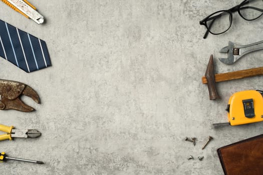 Top view design concept of Father's day and labor day with working tools on blue background.
