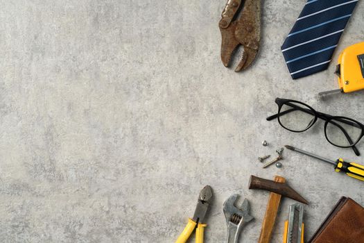 Top view design concept of Father's day and labor day with working tools on blue background.