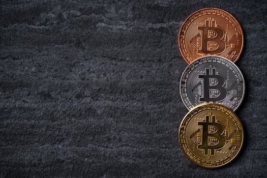 Bitcoin. Top view business cryptocurrency concept money on dark black slate table background.