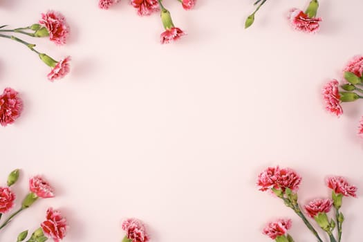 Design concept of Mother's day holiday greeting design with carnation bouquet on pastel pink table background