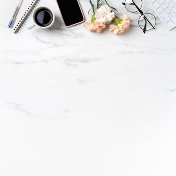 Mother's Day concept. Top view of greeting with carnation flower on mother's office table desk background.