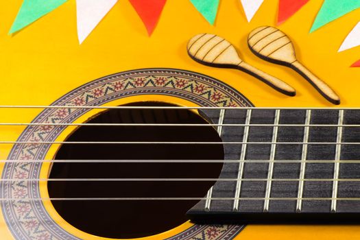 Cinco de Mayo celebration theme with guitar and maracas close-up