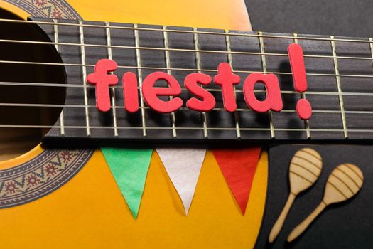 Cinco de Mayo celebration fiesta theme guitar close-up with maracas