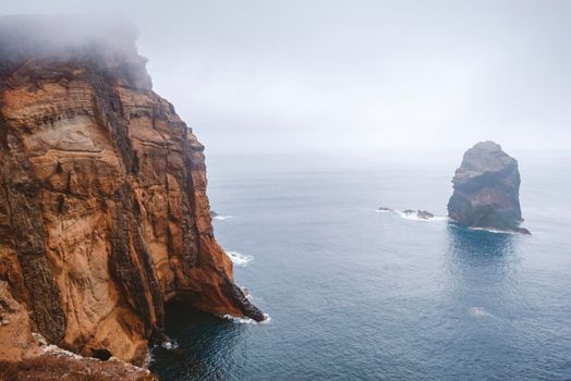 foggy atmosphere at rocky shore of Madeira Island