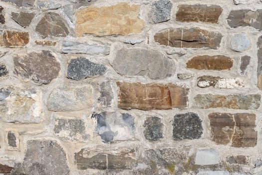 Old ancient brick wall, old texture of stone blocks closeup.