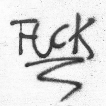 Fuck painted on concrete wall. Graffiti, texture, message, quote, anger concept.