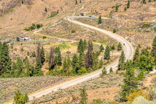 S-curved road in Rocky mountains on summer day