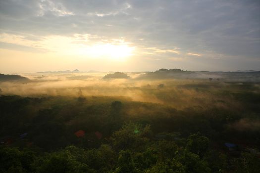 misty morning sunrise, Landscape view of Khao Na Nai Luang temple on peak mountain at Surat Thani Province, Southern of Thailand