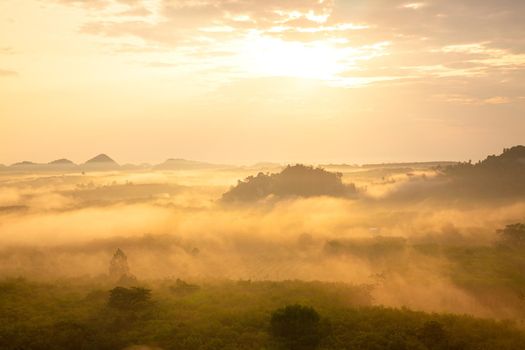 misty morning sunrise, Landscape view of Khao Na Nai Luang temple on peak mountain at Surat Thani Province, Southern of Thailand