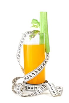 Orange juice celery and measuring tape isolated on white background weight loss dieting concept