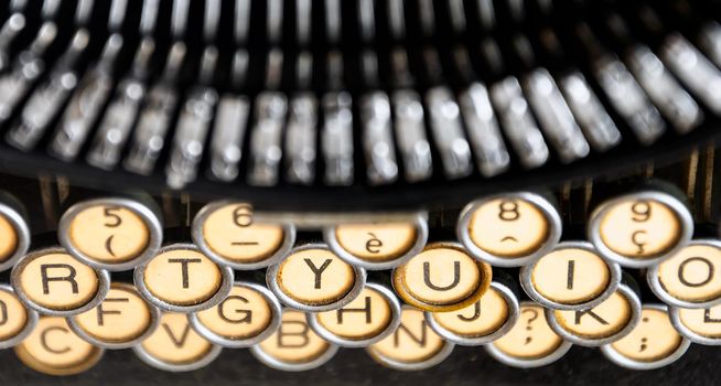 the keys of an old typewriter seen from above. Mechanical tools for writing. Old time journalism