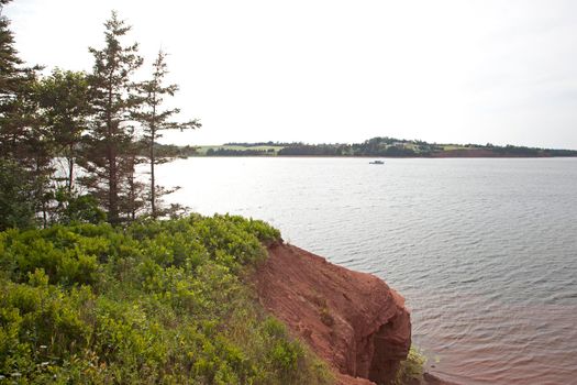 Red cliffs overlook the Atlantic ocean in Prince Edward Island 