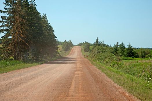 An empty road with red dirt on Canada's east coast