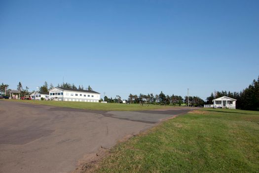 New Glasgow Cavendish, PEI- July 26, 2019: View across the summer lawn to the registration office and rec hall at Marco Polo Land 