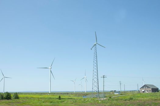 Amherst, Nova Scotia- July 28, 2019: View of turbines on Tantramar Marsh with windmills passing from the highway 