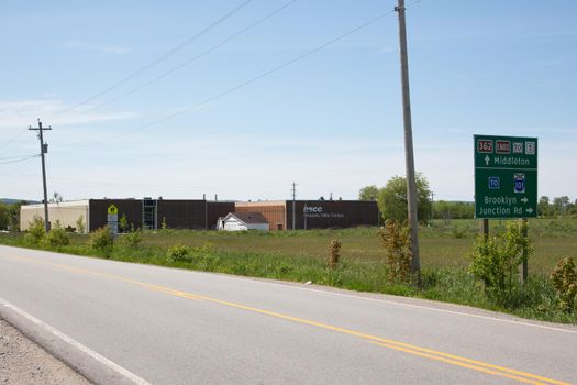 June 4, 2018- Middleton, Nova Scotia: The Annapolis Valley Campus of the Nova Scotia Community College, with a road sign indicating the communities of Brooklyn and Junction Road 