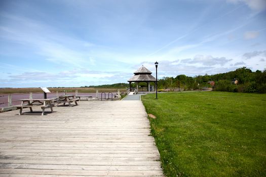 A brown gazebo by the waterfront in Wolfville, Nova Scotia