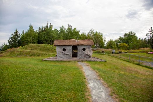 August 18, 2019 - Stewiacke, Nova Scotia - A small stone house in the style of the Flintstones at a local stopping place in Stewiakce 