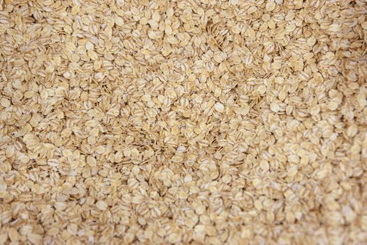 flakes of dry cereal barley in brownish white 