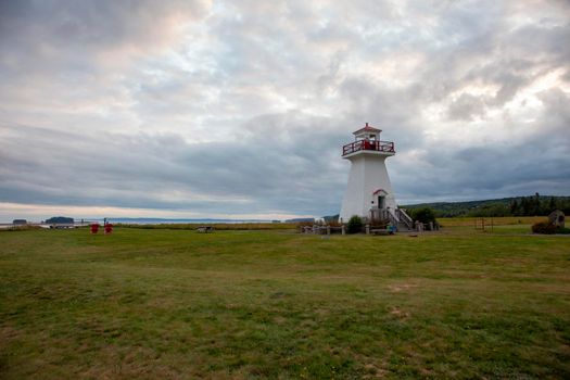  August 18, 2019 - Five Islands, Nova Scotia - landmark lighthouse on the edge of a cliff in the Economy area of Nova Scotia with a red and white lighthouse 