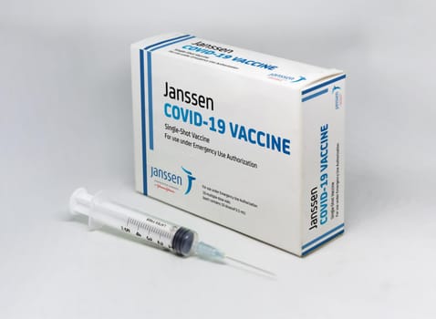 New York, USA, April 12th 2021: A syringe next to the Janssen Covid-19 vaccine box. Janssen is a subsiadiary company of Johnson and Johnson and devoloped the first single-shot Covid-19 vaccine