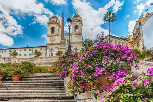 Idillic view of the Church of Trinita dei Monti, iconic landmark at the top of the Spanish Steps in Piazza di Spagna, one of the most famous squares in Rome, Italy