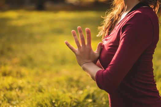 Close up image of woman  sitting in lotus position and meditating,Padmasana/Lotus position.