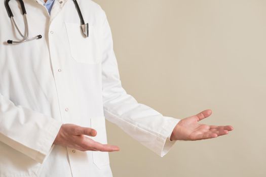 Image of male doctor showing showing welcome gesture.