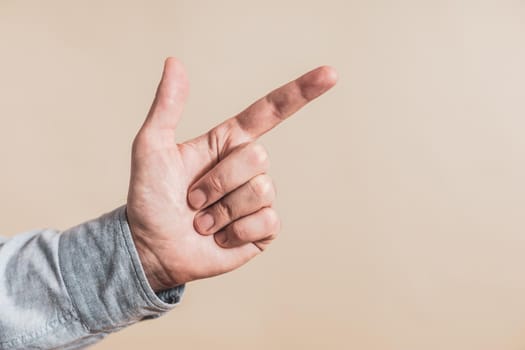 Close up image of male hand pointing.