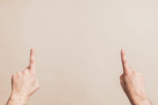 Close up image of male hands pointing.