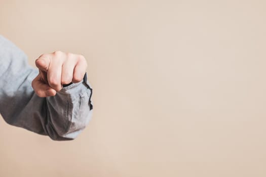 Close up image of male hand pointing.