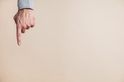 Close up image of male hand pointing.