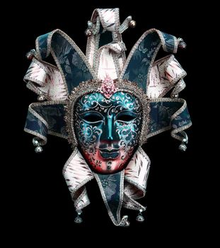 A Blue red and pink Venice carnival mask on a black background