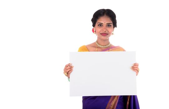 Traditional Girl holding and showing blank white sign board