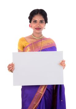 Traditional Girl holding and showing blank white sign board