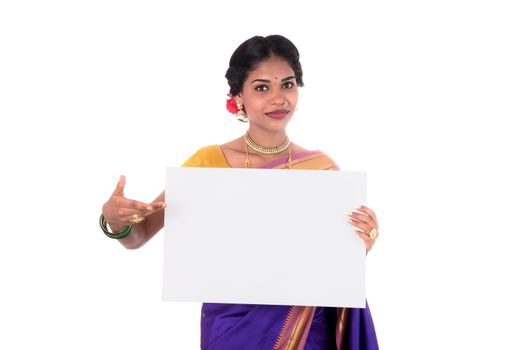 Traditional Girl holding and showing blank white sign board