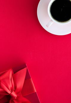 Romantic celebration, lifestyle and birthday present concept - Luxury beauty gift box and coffee on red, flatlay