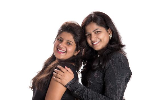 Portrait of happy young girls on a white background