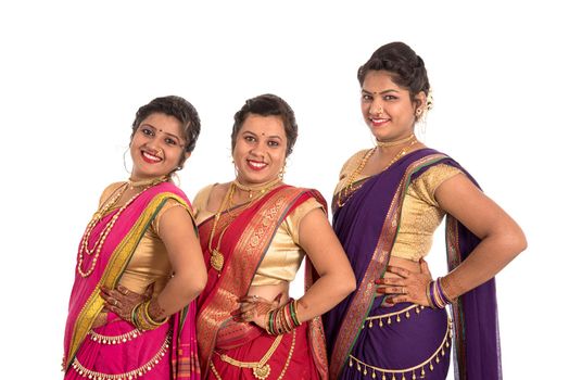 Traditional Beautiful Indian young girls in saree posing on white background