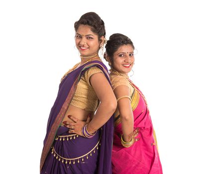 Traditional Beautiful Indian young girls in saree posing on white background